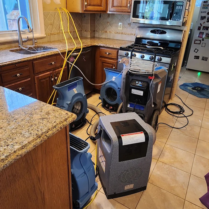 Kitchen water damage cleanup Kitchen water damage cleanup using dehumidifiers and air movers by Kraus Restoration